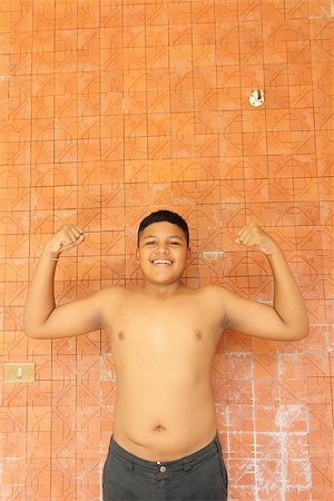 Portrait of Thai teen boy showing off his Muscles Stock Photo - Budget Royalty-Free & Subscription, Code: 400-06768921