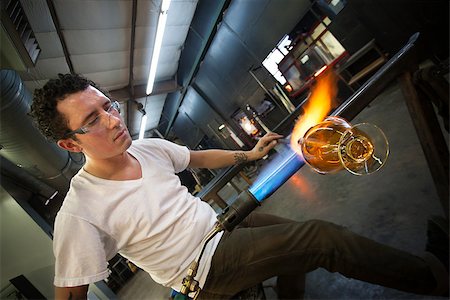 Young man working with blowtorch on glass object Stock Photo - Budget Royalty-Free & Subscription, Code: 400-06768985