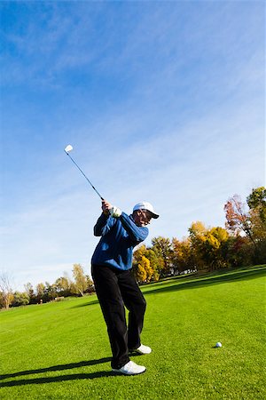 Man playing golf on a beautiful day Stock Photo - Budget Royalty-Free & Subscription, Code: 400-06769815