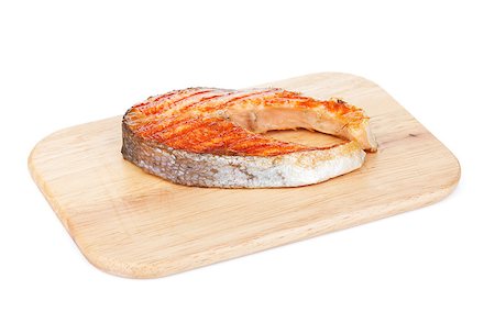 simsearch:400-07179735,k - Grilled salmon steak on cutting board. Isolated on white background Foto de stock - Super Valor sin royalties y Suscripción, Código: 400-06769869