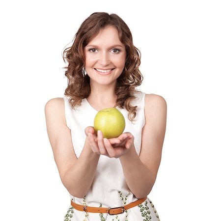 rozbyshaka (artist) - Portrait of lovely young girl which gives of a green apple in hands over white background Foto de stock - Super Valor sin royalties y Suscripción, Código: 400-06760530