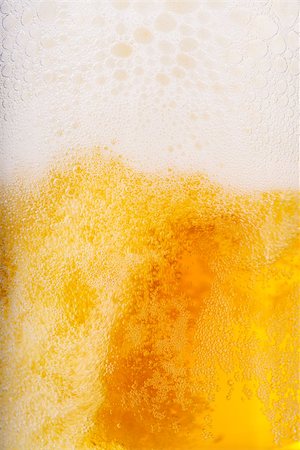 simsearch:659-03527530,k - Beer and white froth background. Closeup view. Photographie de stock - Aubaine LD & Abonnement, Code: 400-06760692