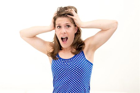 person screaming pulling hair - crazy woman making a face and pulling hair on white background Stock Photo - Budget Royalty-Free & Subscription, Code: 400-06761174
