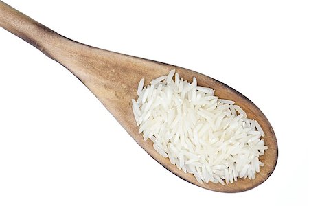 Closeup overview of rice in a wooden spoon Foto de stock - Royalty-Free Super Valor e Assinatura, Número: 400-06761395