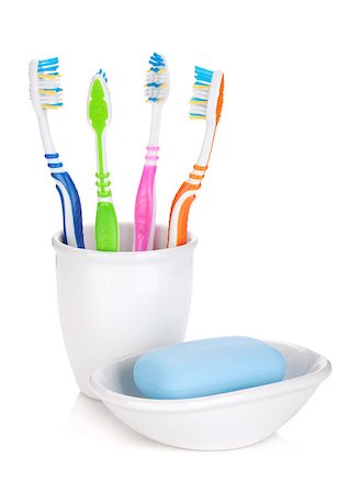 simsearch:400-04552289,k - Four colorful toothbrushes and soap. Isolated on white background Foto de stock - Super Valor sin royalties y Suscripción, Código: 400-06761588