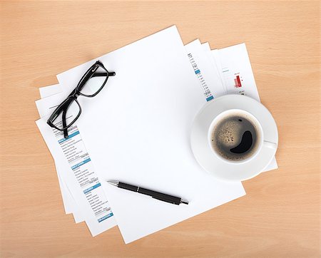 Blank paper with pen, glasses and coffee cup over financial documents Stock Photo - Budget Royalty-Free & Subscription, Code: 400-06761606