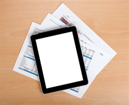 simsearch:400-08530598,k - Tablet with blank screen over papers with numbers and charts. View from above Stock Photo - Budget Royalty-Free & Subscription, Code: 400-06761699