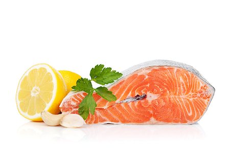 simsearch:633-01274958,k - Salmon with herbs and lemon. Isolated on white background Photographie de stock - Aubaine LD & Abonnement, Code: 400-06761731