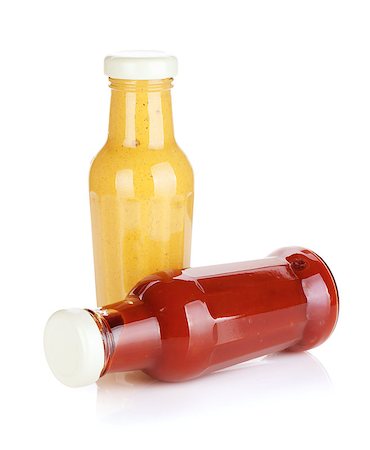 Mustard and ketchup glass bottles. Isolated on white background Stock Photo - Budget Royalty-Free & Subscription, Code: 400-06761762