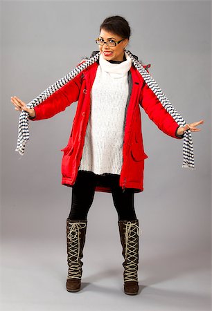 Fashion model posing in red jacket and neckpiece on grey background. Foto de stock - Super Valor sin royalties y Suscripción, Código: 400-06761853