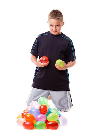 people in ready for fight - Boy with a pile of water balloons isolated on white background Stock Photo - Budget Royalty-Free & Subscription, Code: 400-06761903