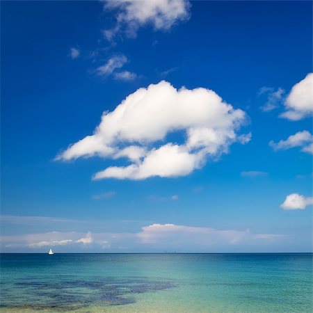 simsearch:400-06480005,k - Ocean day landscape with blue cloudy sky and little sailboat Foto de stock - Super Valor sin royalties y Suscripción, Código: 400-06762666
