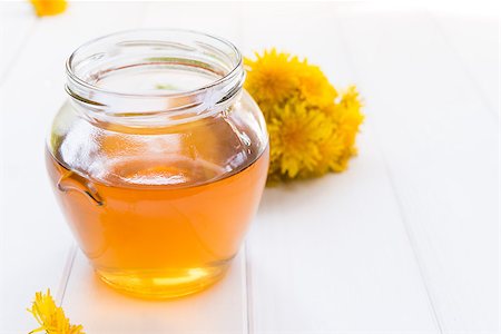 flowers in jam jar - Jar with Syrup of Dandelion's flowers on table Stock Photo - Budget Royalty-Free & Subscription, Code: 400-06762771