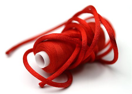 Red threads and red band with a small depth  of sharpness Photographie de stock - Aubaine LD & Abonnement, Code: 400-06763142