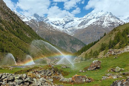 Rainbows in irrigation water spouts in Summer Alps mountain  (Switzerland, near Zermatt) Stock Photo - Budget Royalty-Free & Subscription, Code: 400-06763400