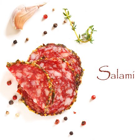 simsearch:400-05273014,k - Sliced salami sausage and spices on a white. Fotografie stock - Microstock e Abbonamento, Codice: 400-06763929