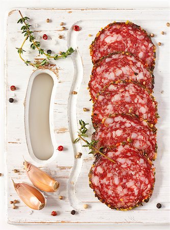 simsearch:400-05273014,k - Delicious salami with thyme and spices on an old white board. Fotografie stock - Microstock e Abbonamento, Codice: 400-06763922