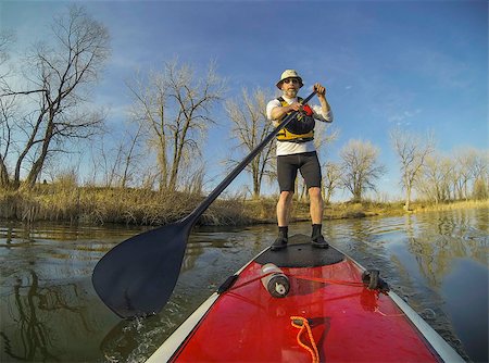 simsearch:400-07795226,k - mature male paddler on a red stand up paddleboard (SUP), calm lake in Colorado, early spring Foto de stock - Royalty-Free Super Valor e Assinatura, Número: 400-06770084
