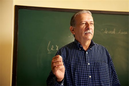 professor at chalkboard - People and education, professor talking to students during lesson in college, Law School, University of Havana, Cuba Stock Photo - Budget Royalty-Free & Subscription, Code: 400-06770345