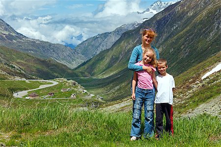 switzerland people on road - Family (mother with children) walk on summer Alps mountain plateau (Switzerland, Passo del San Gottardo) Stock Photo - Budget Royalty-Free & Subscription, Code: 400-06770724
