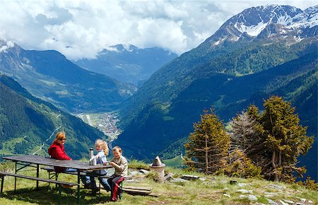 switzerland people on road - Family (mother with children) rest on summer Alps mountain plateau (Switzerland, Passo del San Gottardo) Stock Photo - Budget Royalty-Free & Subscription, Code: 400-06770722
