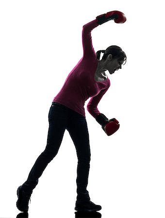 one caucasian woman with boxing gloves  in silhouette studio isolated on white background Stock Photo - Budget Royalty-Free & Subscription, Code: 400-06771010