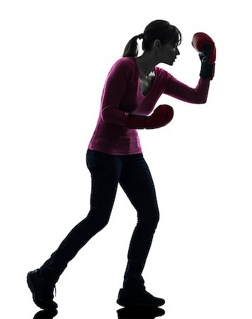 one caucasian woman with boxing gloves  in silhouette studio isolated on white background Stock Photo - Budget Royalty-Free & Subscription, Code: 400-06771011