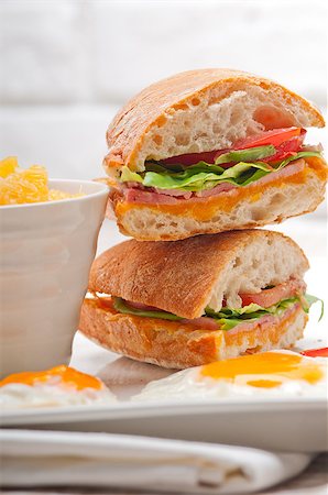 simsearch:400-06641159,k - fresh ciabatta panini sandwich with eggs tomato lettuce Foto de stock - Super Valor sin royalties y Suscripción, Código: 400-06771134