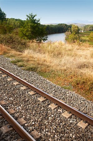 Rail road beside river and landscape vertical Foto de stock - Royalty-Free Super Valor e Assinatura, Número: 400-06771151