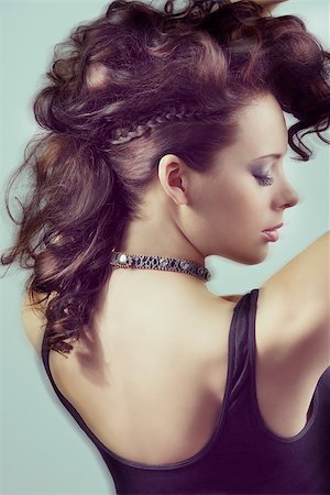simsearch:400-06790945,k - close-up portrait of fashion brunette lady with creative curly hair-style and black bra with moving blur effect Photographie de stock - Aubaine LD & Abonnement, Code: 400-06771405