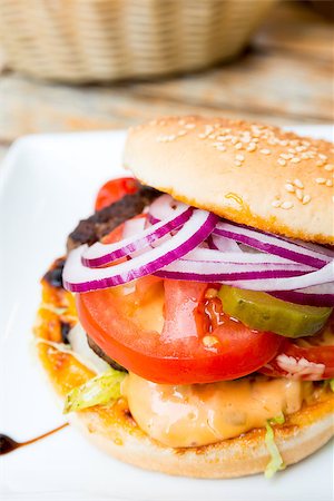 simsearch:400-05330097,k - Cheese burger - American cheese burger with fresh salad Stock Photo - Budget Royalty-Free & Subscription, Code: 400-06771552