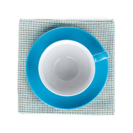 simsearch:400-04799995,k - Blue coffee cup over kitchen towel. Isolated on white background Foto de stock - Super Valor sin royalties y Suscripción, Código: 400-06772198