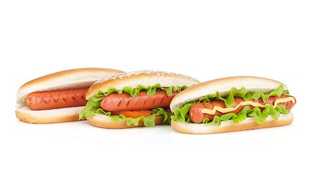 Three hot dogs with various ingredients. Isolated on white background Stock Photo - Budget Royalty-Free & Subscription, Code: 400-06772202