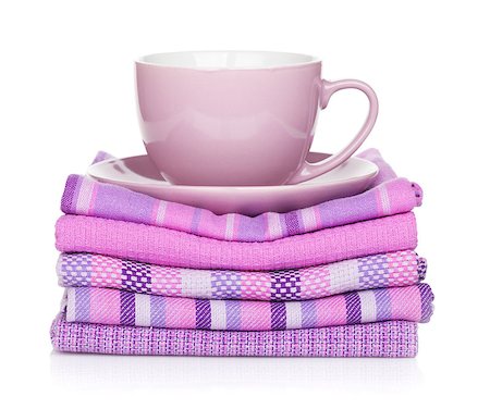 simsearch:400-04799995,k - Coffee cup over kitchen towels. Isolated on white background Stock Photo - Budget Royalty-Free & Subscription, Code: 400-06772216