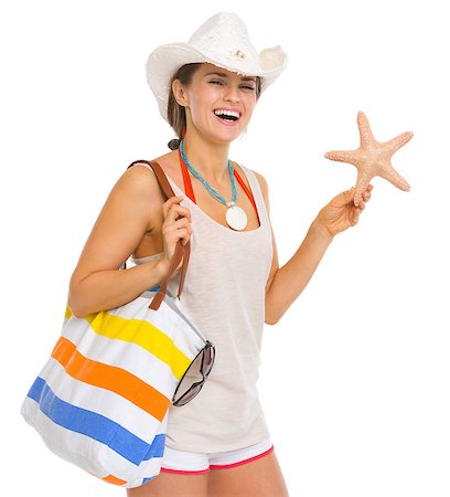 simsearch:400-06772308,k - Happy beach young woman holding starfish Stockbilder - Microstock & Abonnement, Bildnummer: 400-06772339