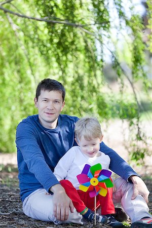 simsearch:400-07715953,k - handsome young father and his son at the park Stock Photo - Budget Royalty-Free & Subscription, Code: 400-06772528
