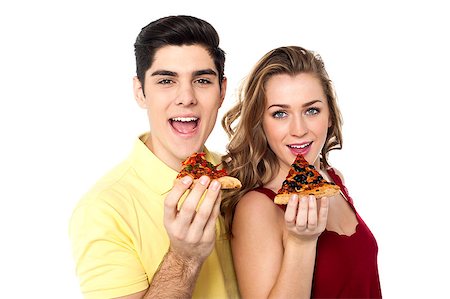 friends and eat and pizza - Boy and girl each holding slice of yummy pizza. Stock Photo - Budget Royalty-Free & Subscription, Code: 400-06772609