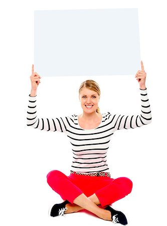 simsearch:400-06695536,k - Seated woman showing blank billborad over her head Stock Photo - Budget Royalty-Free & Subscription, Code: 400-06772629