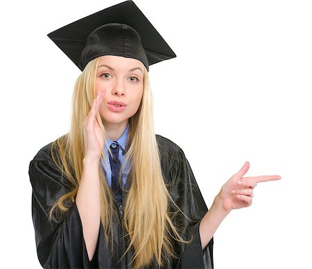 simsearch:400-06772308,k - Young woman in graduation gown pointing on copy space Stockbilder - Microstock & Abonnement, Bildnummer: 400-06772949