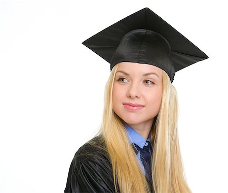 Happy young woman in graduation gown looking on copy space Stock Photo - Budget Royalty-Free & Subscription, Code: 400-06772943