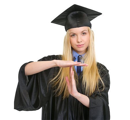 Young woman in graduation gown showing stop gesture Stock Photo - Budget Royalty-Free & Subscription, Code: 400-06772958