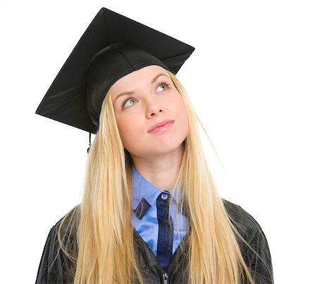 Young woman in graduation gown looking up on copy space Stock Photo - Budget Royalty-Free & Subscription, Code: 400-06772950