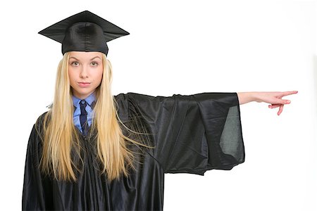 simsearch:400-06772308,k - Young woman in graduation gown pointing on copy space Stockbilder - Microstock & Abonnement, Bildnummer: 400-06772953