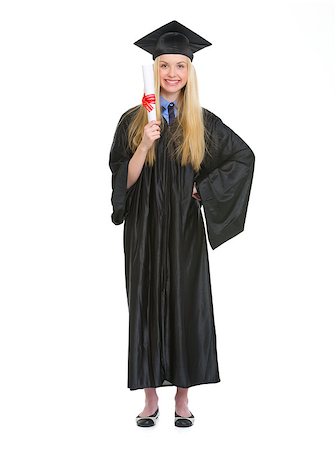 simsearch:400-07305822,k - Full length portrait of young woman in graduation gown showing diploma Stock Photo - Budget Royalty-Free & Subscription, Code: 400-06772969