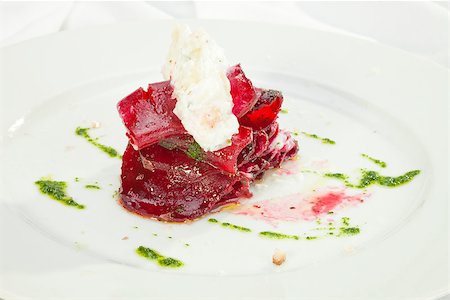 plate of cold cuts and cheeses - Vegetarian Beatroot Carpaccio w goat cheese and Pesto Stock Photo - Budget Royalty-Free & Subscription, Code: 400-06787126