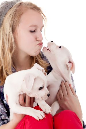 Young girl having a great time with the puppies Photographie de stock - Aubaine LD & Abonnement, Code: 400-06787397