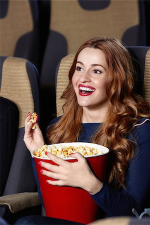 photo of theatre audience laughing - Smiling young girl in cinema Stock Photo - Budget Royalty-Free & Subscription, Code: 400-06787489