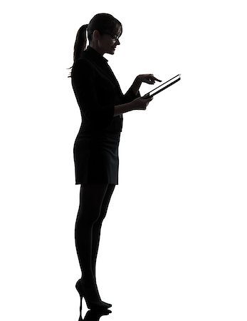 people ipad computer studio - one business woman computer computing typing digital tablet  silhouette studio isolated on white background Stock Photo - Budget Royalty-Free & Subscription, Code: 400-06788117