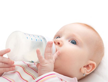 simsearch:400-06073989,k - Baby Girl Drinking Milk from Bottle on White Background Photographie de stock - Aubaine LD & Abonnement, Code: 400-06788210