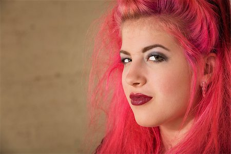 Conceited teenage female with pink hair close up Stock Photo - Budget Royalty-Free & Subscription, Code: 400-06788322